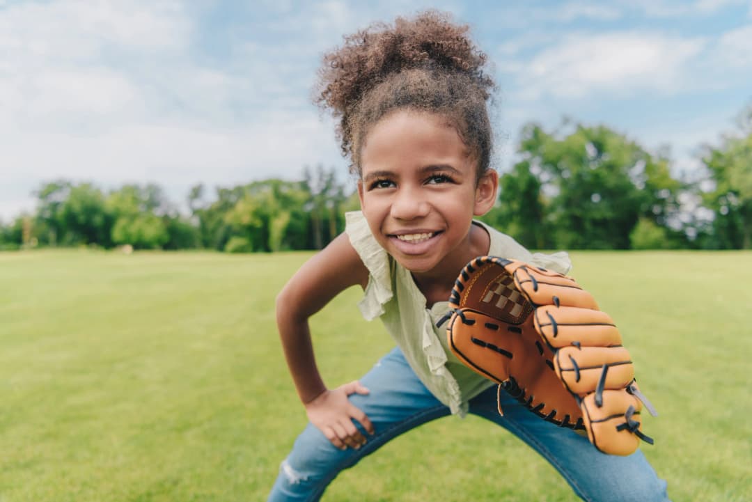 A baseball catcher in full protective gear